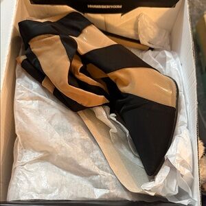 Women mesh stiletto over the knee boots.